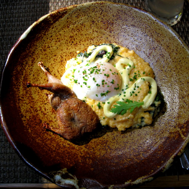 Woodfired quail with grits, braised greens, poached farm egg, and hollandaise