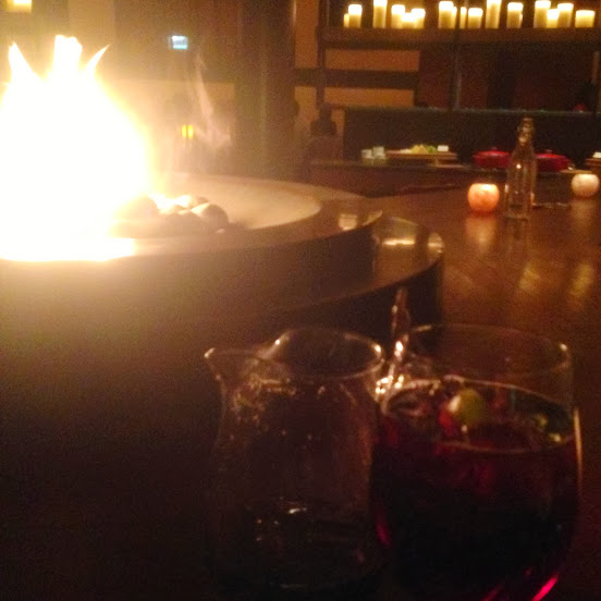 Red apple orchard sangria (shiraz, brandy, apple	juice, and cinnamon sticks) at our fireside table