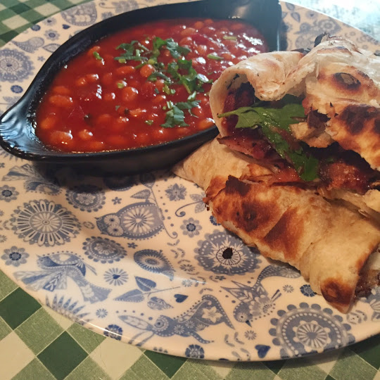 Bacon & egg naan roll with masala beans 