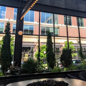 Glass-walled patio, with a view of Google across the street