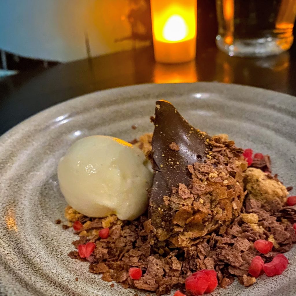 Chocolate rum ball with toasted milk ice cream